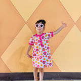 girl wearing 60s vintage toddler flower dress