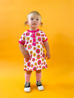 toddler girl wearing 60s flower power print dress