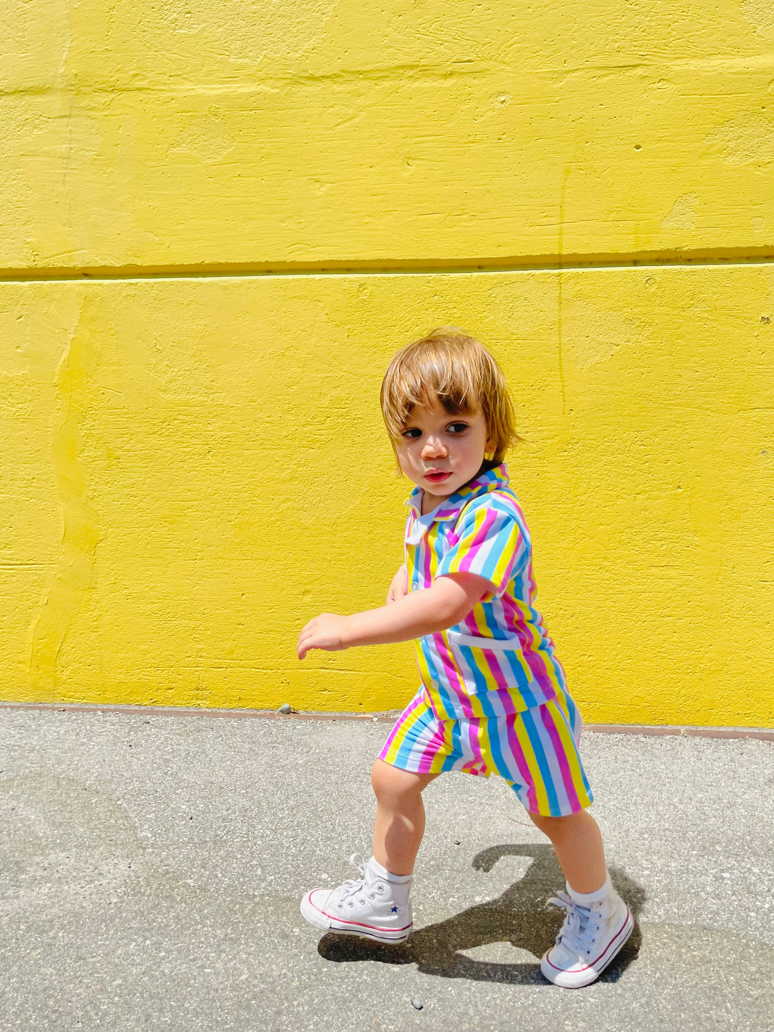 toddler boy wearing colorful shirt and shorts summer outfit