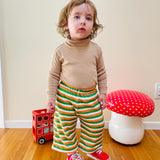 cute toddler boy wearing retro outfit and vintage wide leg pants