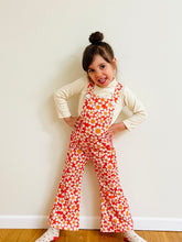 Load image into Gallery viewer, toddler girl wearing vintage inspired flower power red and white bell bottom overalls