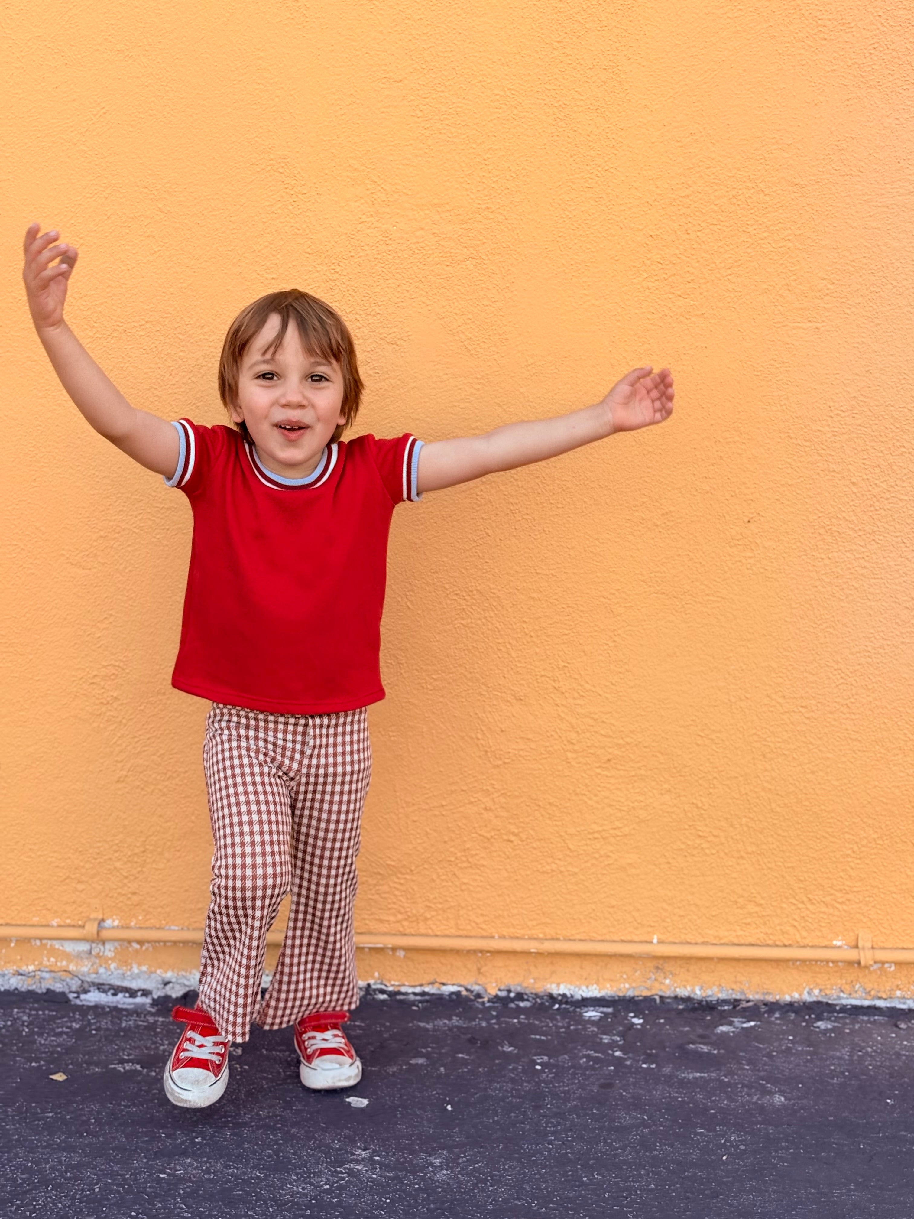 child wearing brown gingham retro bell bottom pants