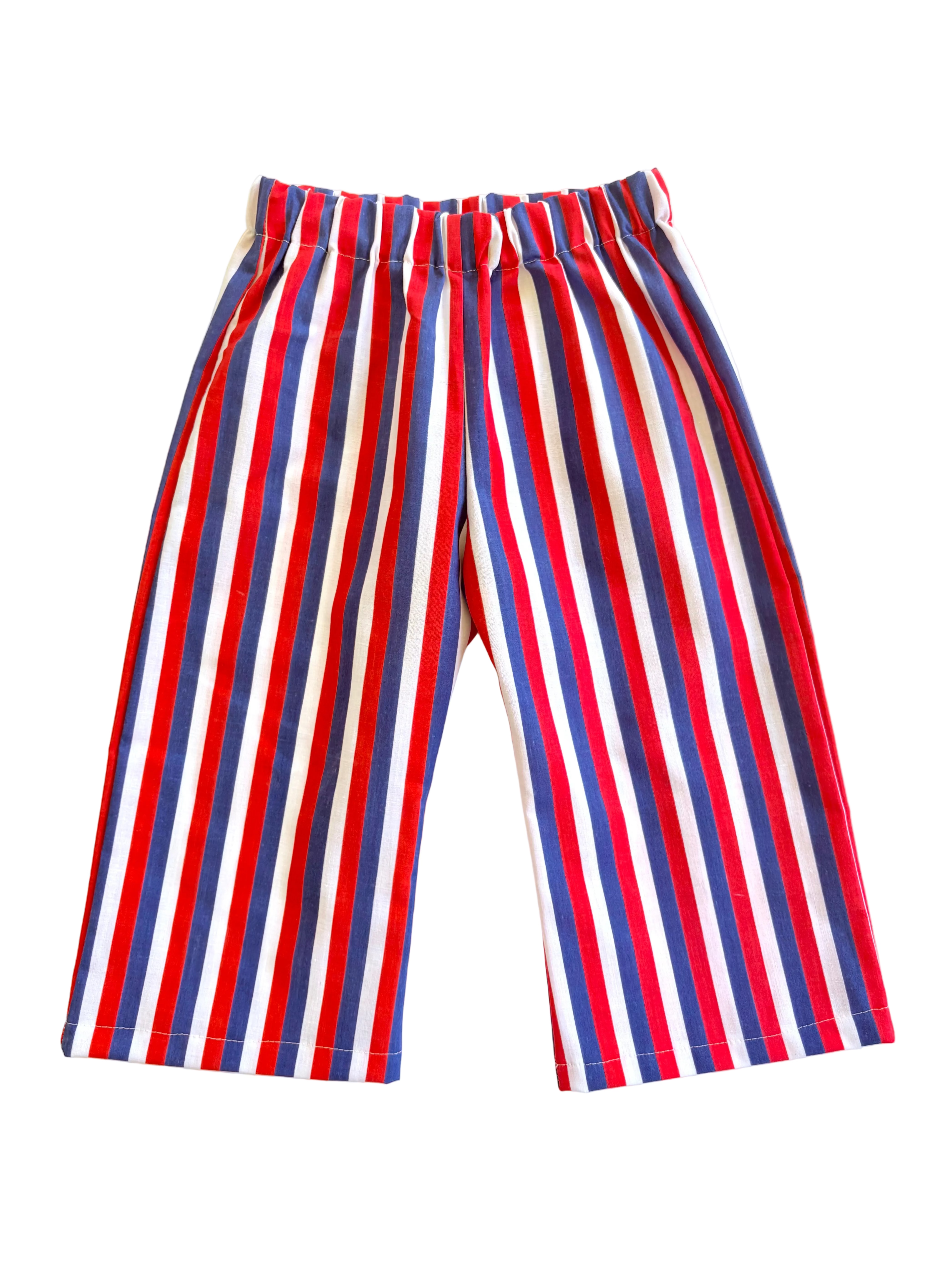 children's vintage Red, white, and blue striped pants on a light yellow background