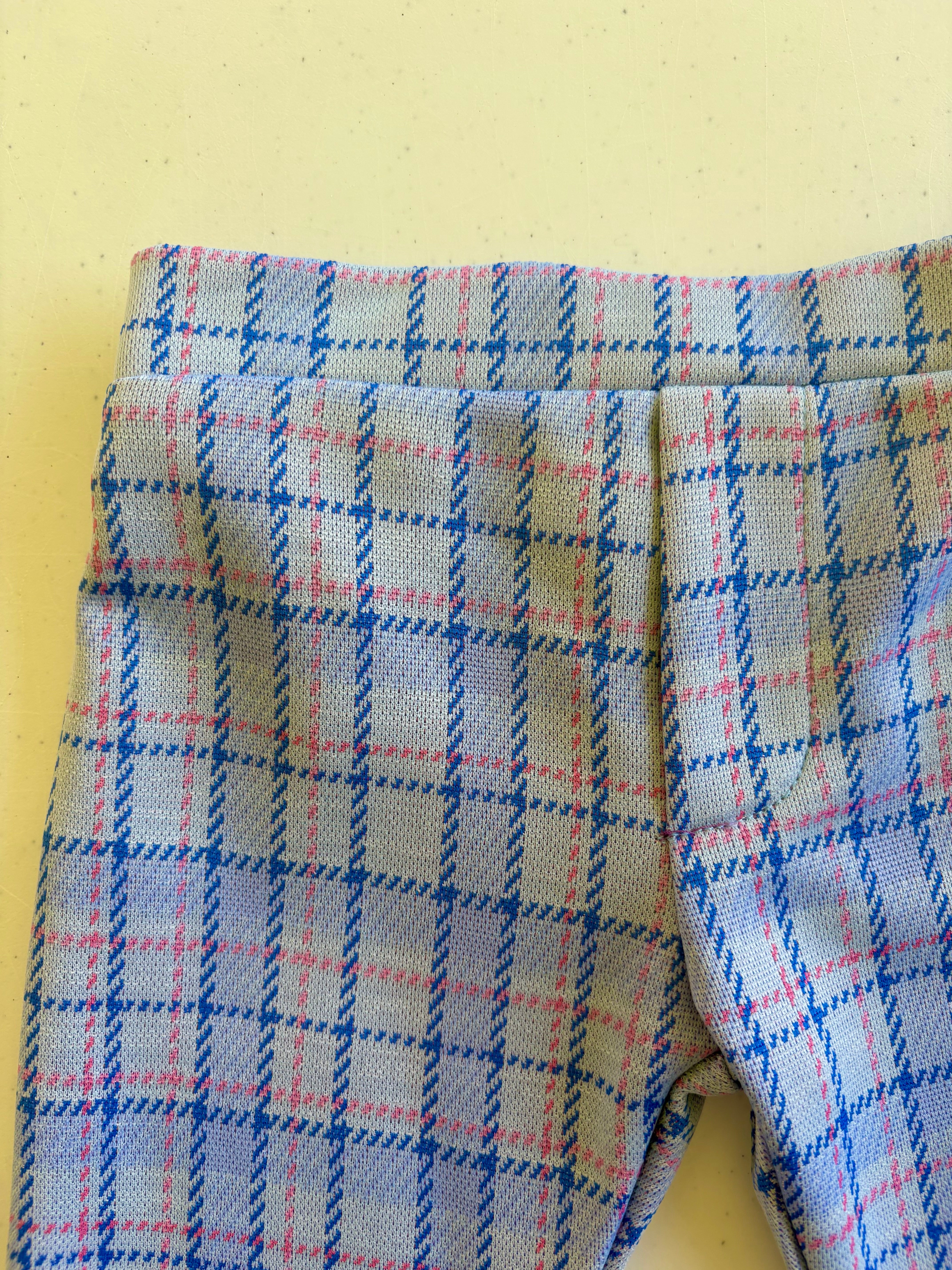close up of kids plaid vintage style pants on yellow background 