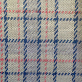 Close-up of fabric with blue and pink plaid pattern