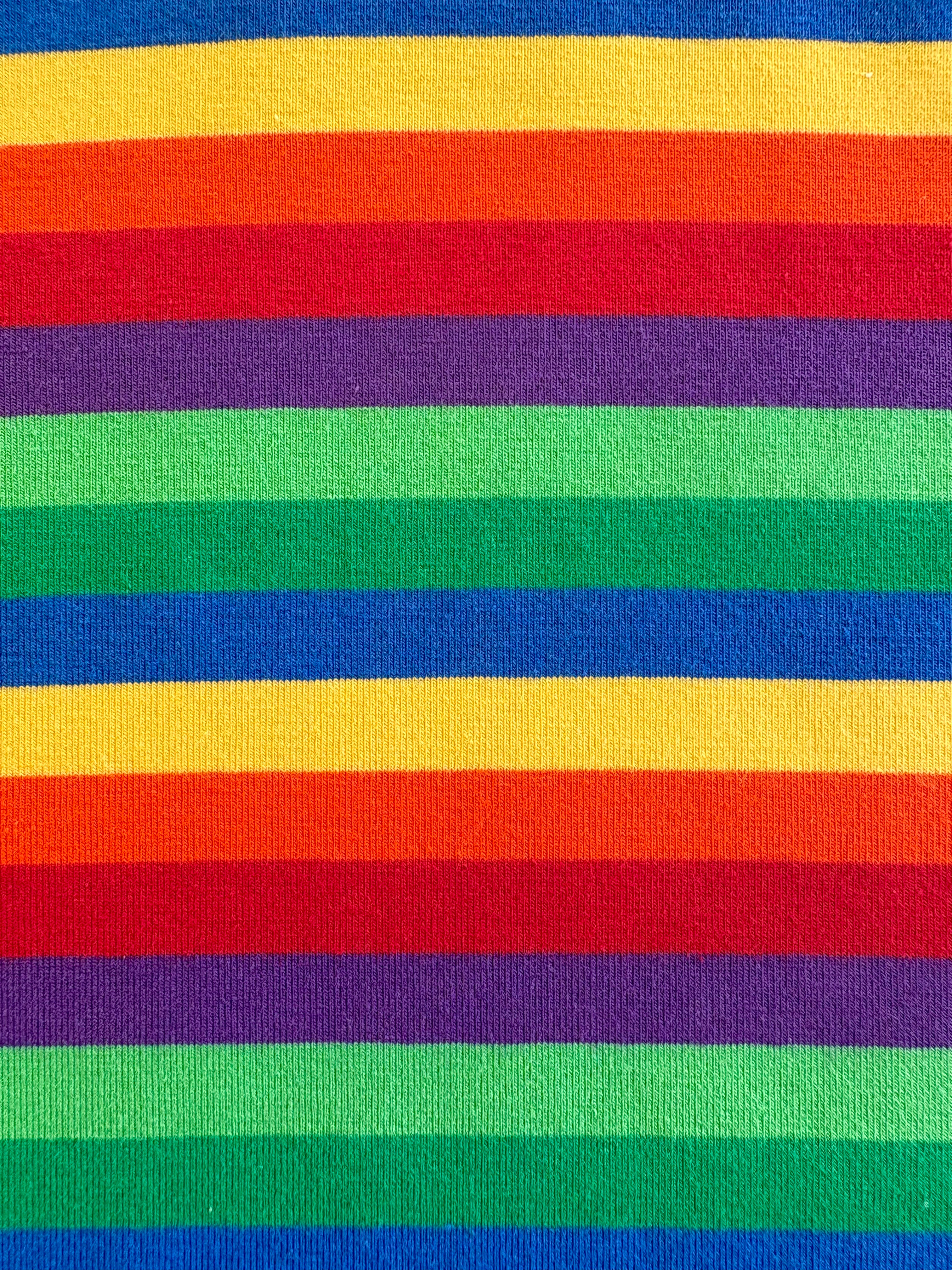 closeup of toddler rainbow shirt