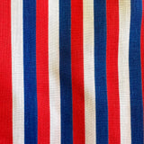 Fabric with red, white, and blue vertical stripes