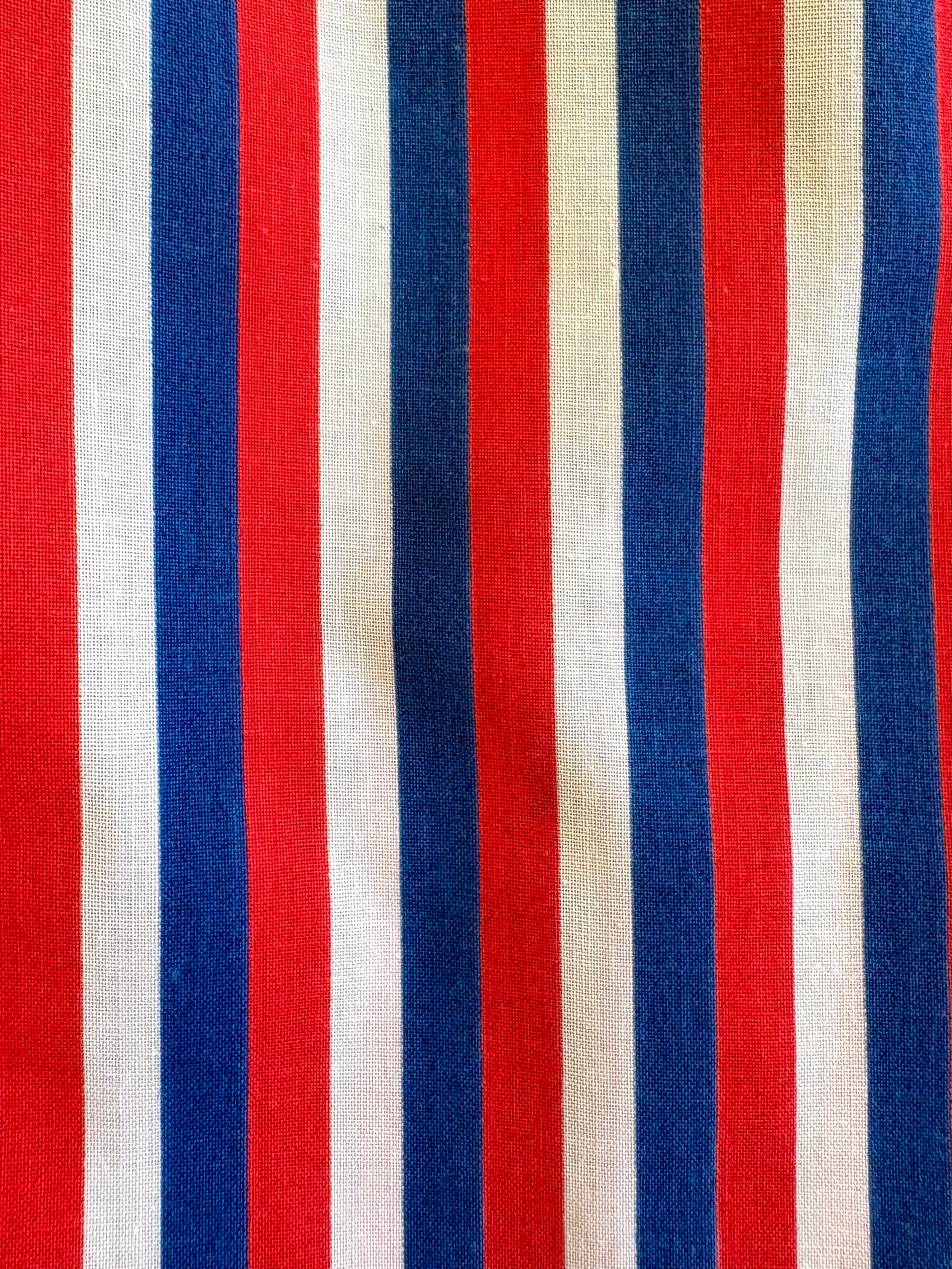 Fabric with red, white, and blue vertical stripes