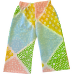 Colorful patterned toddler kids pants on a light background