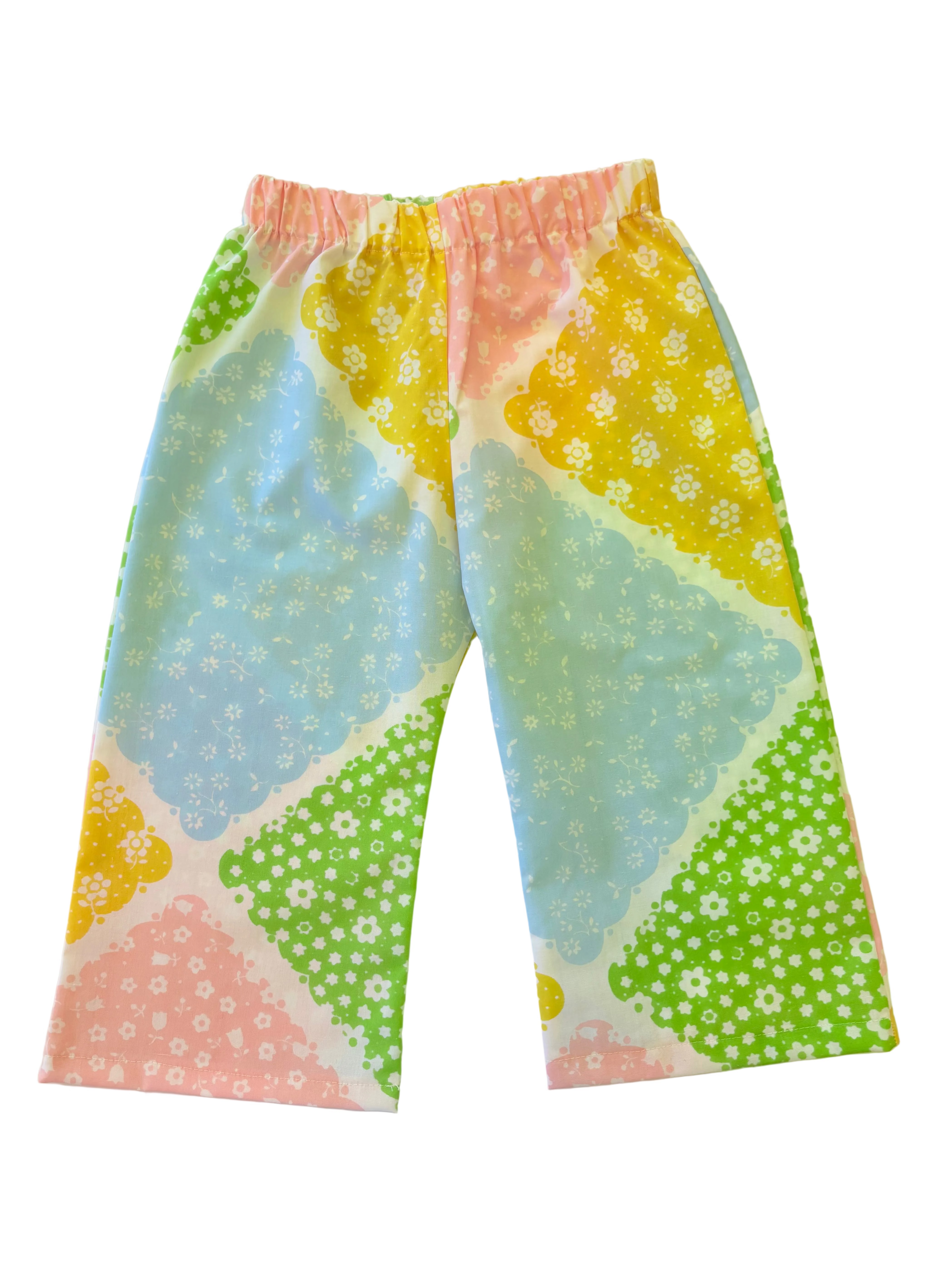 Colorful patterned toddler kids pants on a light background