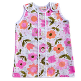 girls first birthday groovy pink floral dress on white background