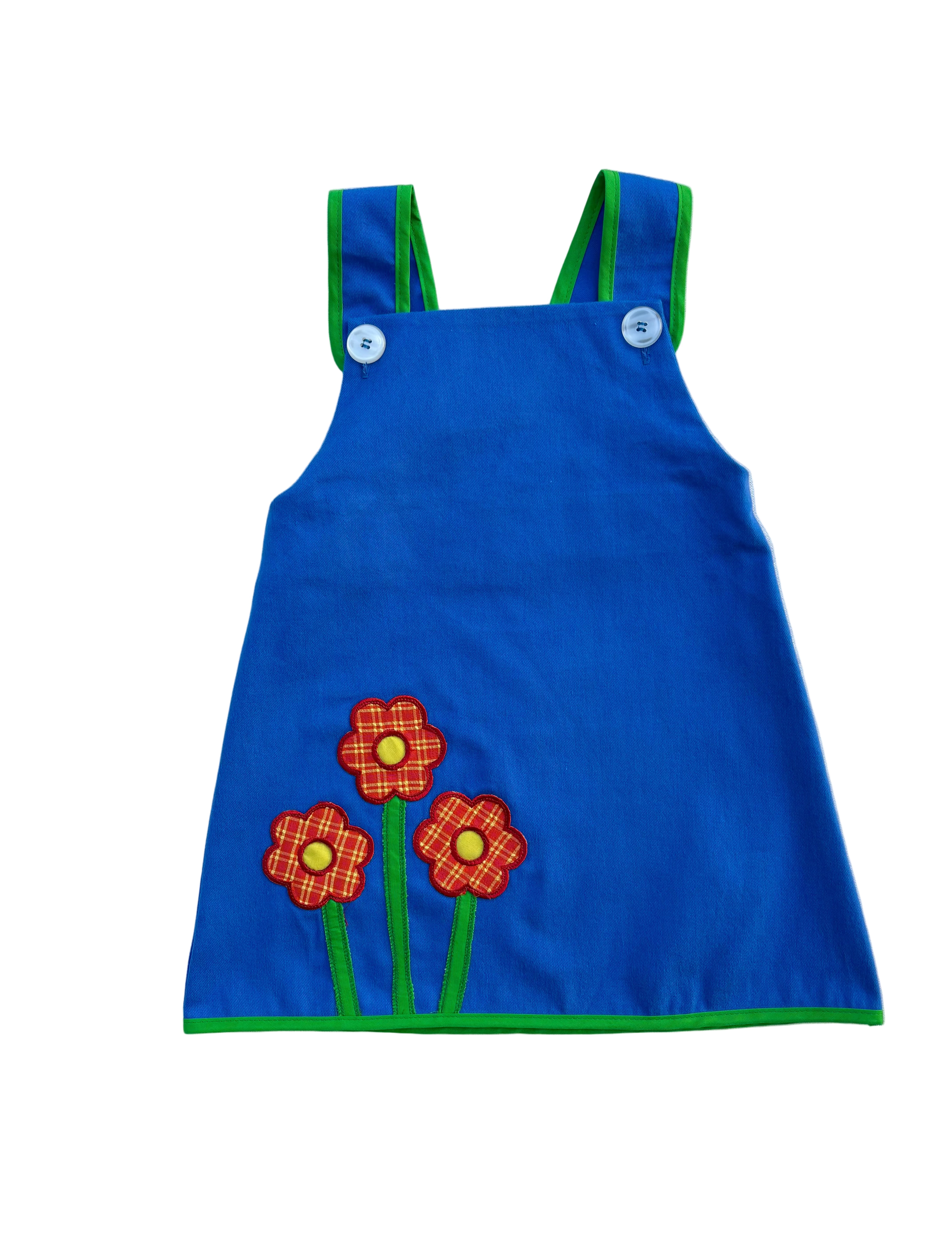 girls vintage inspired blue a-line dress with flower patches on a white background
