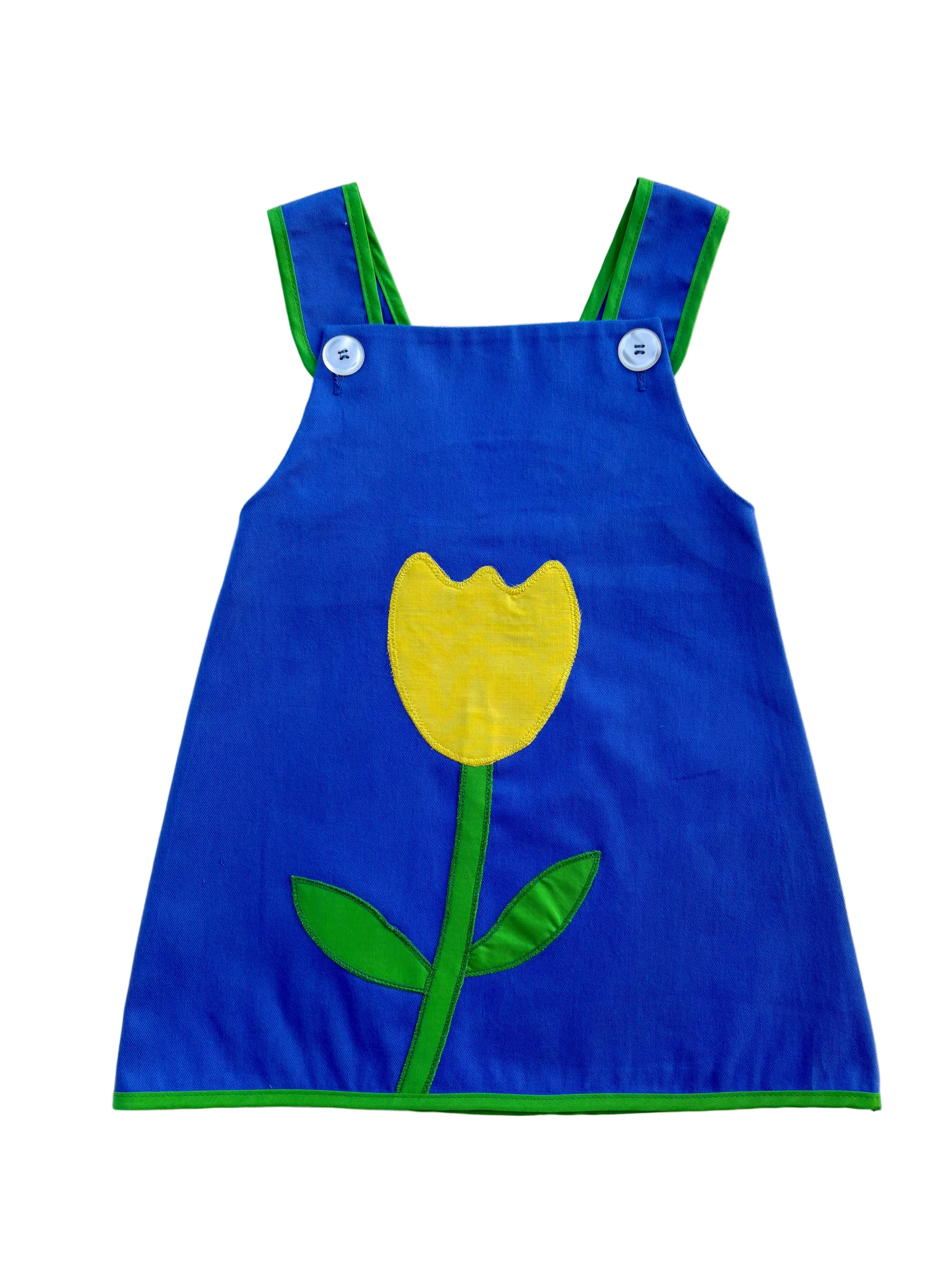 Blue dress with a yellow tulip design on a white background