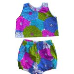 girls colorful floral summer outfit set with blue purple and green flowers on a white background 