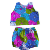 girls colorful floral summer outfit set with blue purple and green flowers on a white background 