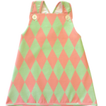 Mint and pink vintage style adorable harlequin-patterned dress with pink and green diamonds on a white background