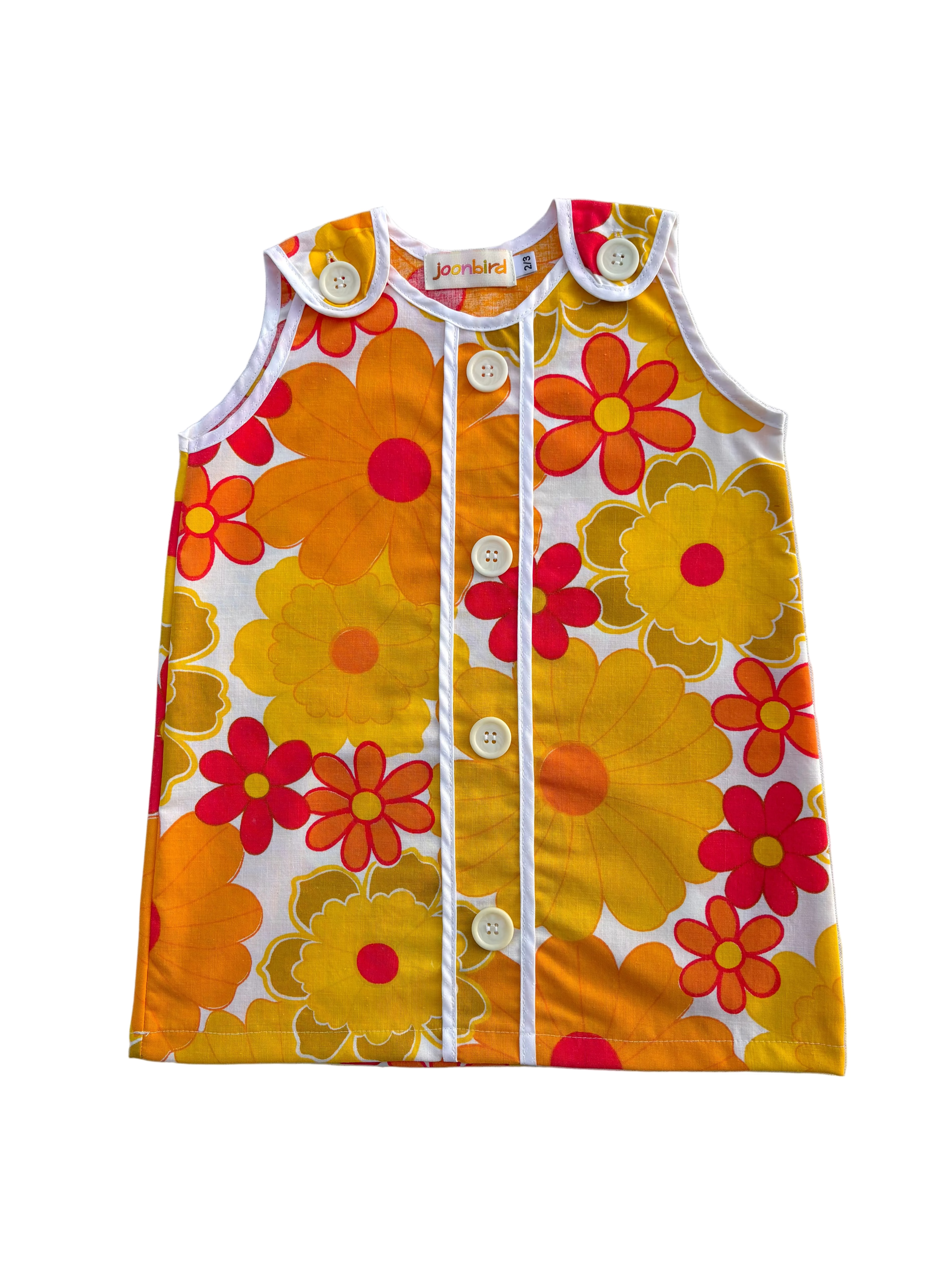 girls flower power mod style red and yellow floral dress with white background 