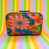 Vintage 1960s flower power travel suitcase