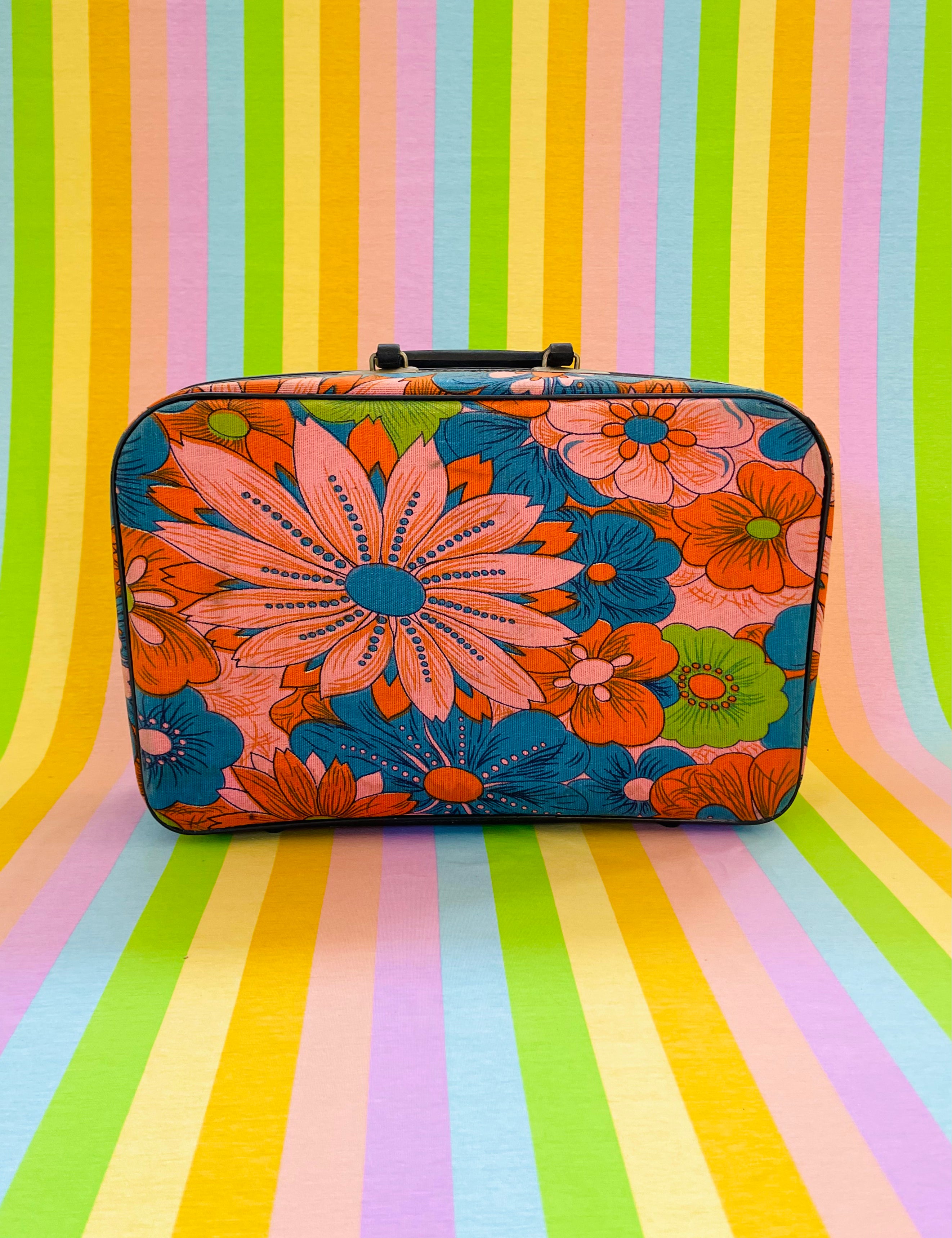 Vintage 1960s flower power travel suitcase