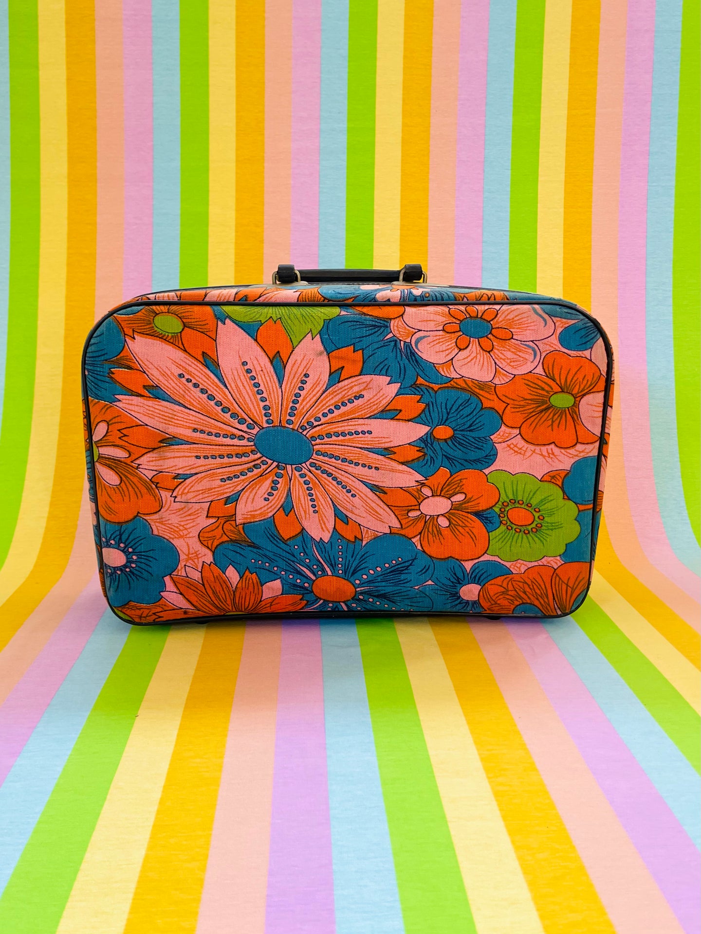 Vintage 1960s flower power travel suitcase