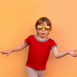 Child wearing red shirt vintage inspired 