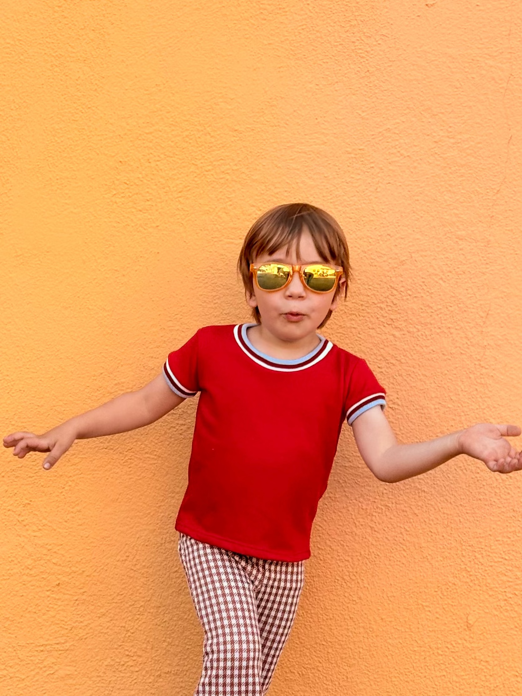 Child wearing red shirt vintage inspired 