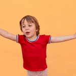 toddler boy wearing cool retro funky red shirt with trim