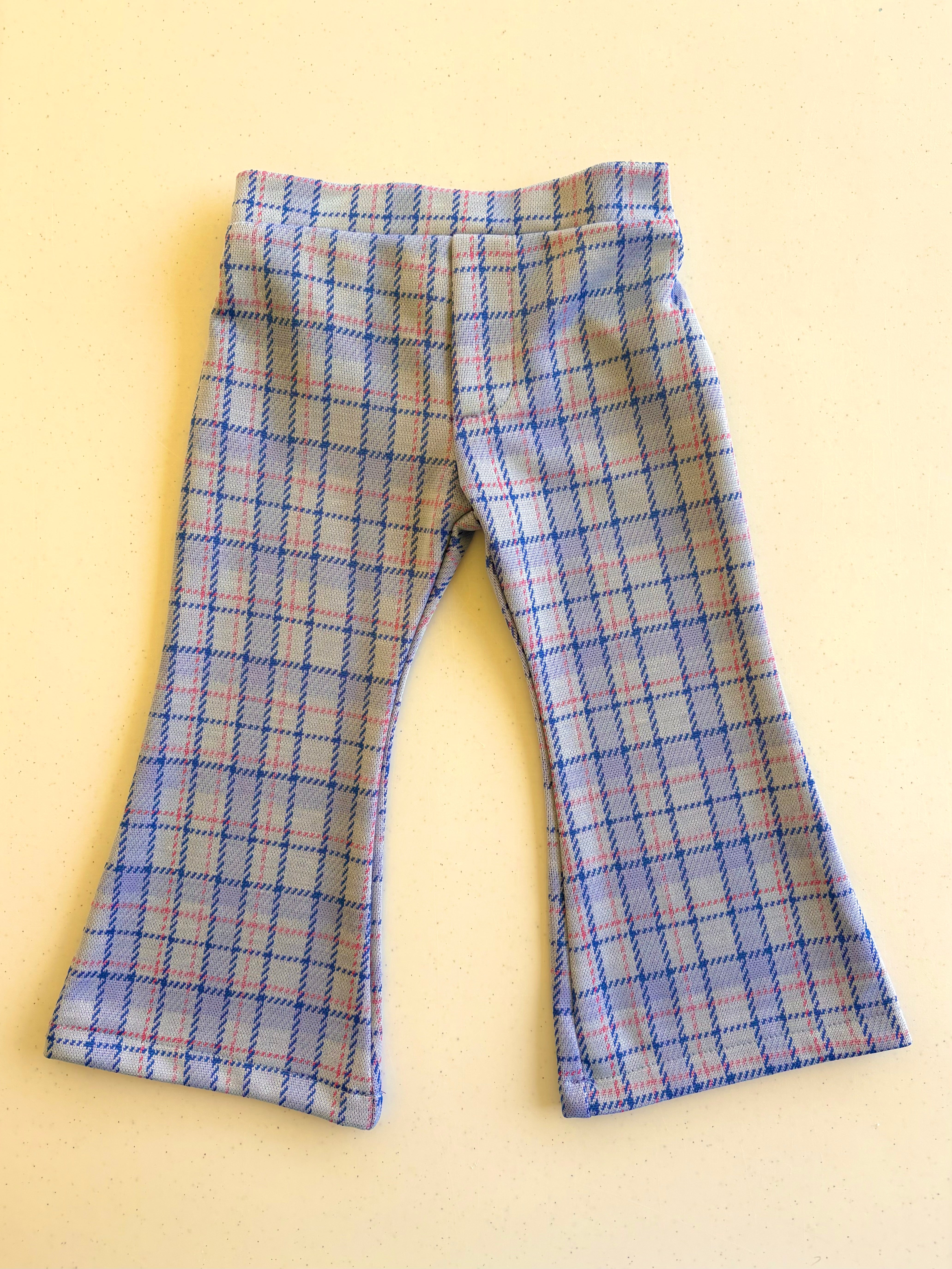 kids plaid pants on yellow background